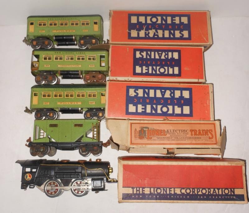 PRE-WAR LIONEL TRAIN SET WITH ACCESSORIES: Including engine and tender, two #607 Pullman, #608 observation, #653 hopper car, with rough boxes, including lots of track