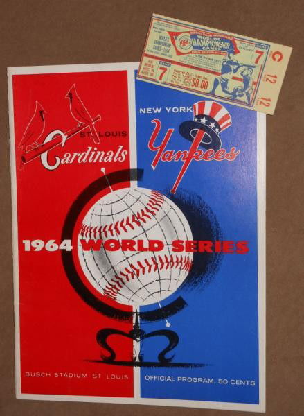 1964 WORLD SERIES PROGRAM AND TICKET STUB: From game 7 at (old) Busch Stadium (Sportsman's Park), St. Louis. The St. Louis Cardinals defeated the New York Yankees. Both program and stub in very good + condition, the scorecards in the program n