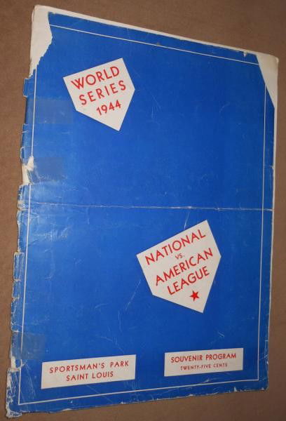 1944 WORLD SERIES PROGRAM: A Cardinal program from Sportsman's Park, St. Louis. The all St. Louis World Series had the Cardinals defeating the Browns. Shows much wear through the binding with tape keeping front and back connect