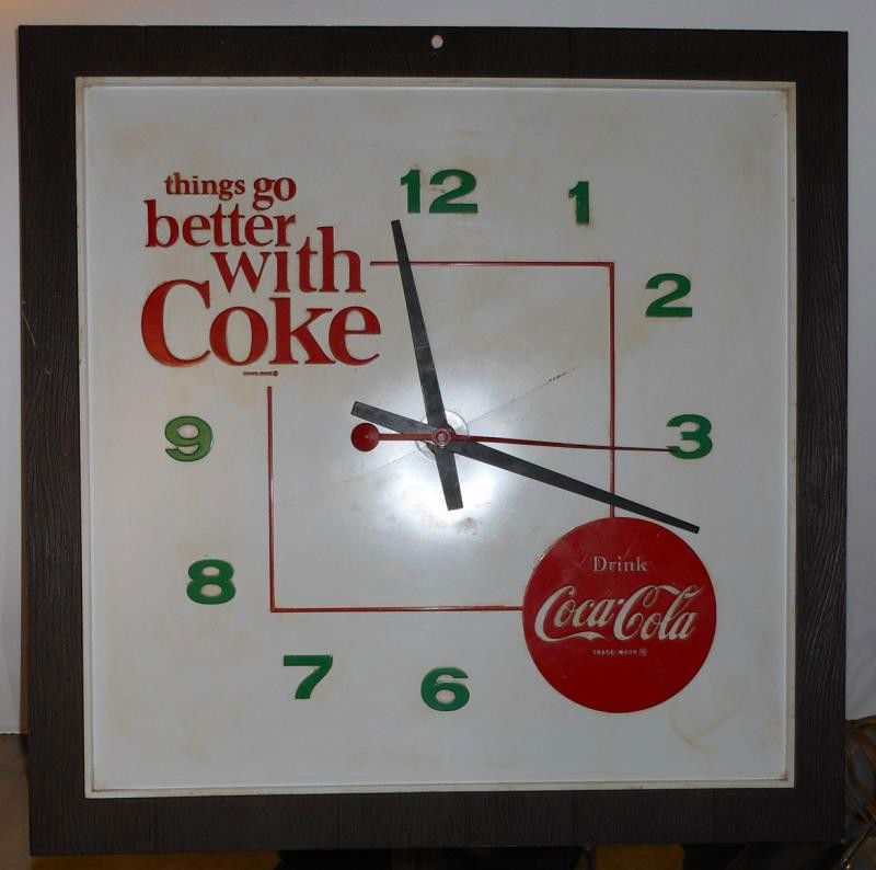 COCA-COLA 1960s WALL CLOCK: Square plastic, THINGS GO BETTER WITH COKE, and red bottle cap, faux wood panel framing, 17 in. square.