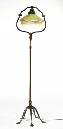 TIFFANY STUDIOS, NEW YORK: HARP FLOOR LAMP, bronze floor lamp with five-point lily pad form feet, marked Tiffany Studios/New York/423 H, together with a pulled feather designed glass shade, marked L.C.T. 57 3/4 inches (overall)