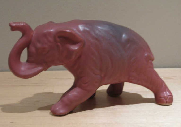VAN BRIGGLE, COLORADO SPRINGS, COLORADO: Elephant, mulberry, incised signature, 4 1/4 x 8 inches