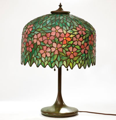HANDEL LAMP COMPANY (1864-1936): Leaded glass table lamp, bronze standard, unmarked, having a floral decorated shade, unmarked. 23 1/2 inches (overall) 15 1/4 inches (shade)
