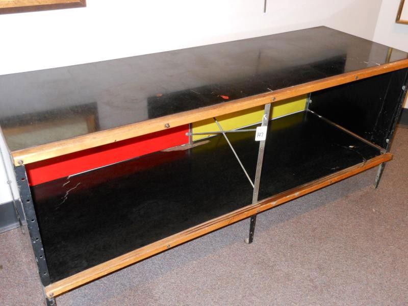 CHARLES & RAY EAMES FOR HERMAN MILLER: ESU 110, circa 1950's, painted birch and zinc plated steel, missing doors. 20 1/2 x 47 x 17 inches