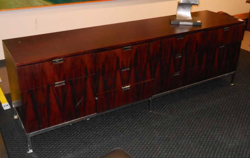 FLORENCE KNOLL, AMERICAN (B.1917): Rosewood credenza, assortment of drawers on chromed steel frame, key locking. 24 3/4 x 74 1/2 x 18 inches