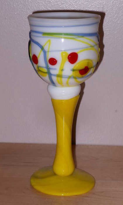 JOEL PHILIP MEYERS, AMERICAN (B.1934): Blown glass stem goblet, white vessel applied with blue, yellow and red, on a yellow stem, etched signature and dated 1970. 8 1/2 x 3 3/8 inches