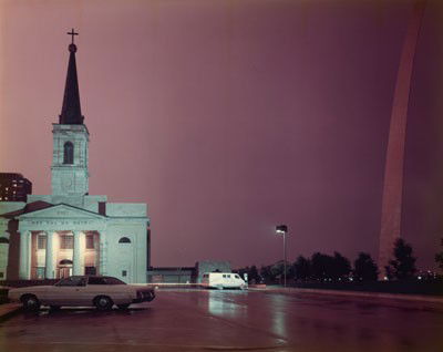 JOEL MEYEROWITZ, AMERICAN (B.1938): THE OLD CATHEDRAL AND THE ARCH, 1978, #9 from the portfolio of twelve, ST. LOUIS AND THE ARCH, RC Ektacolor print, 65/75, signed and numbered, published by the Greenberg Gallery, St. Louis, framed. 16