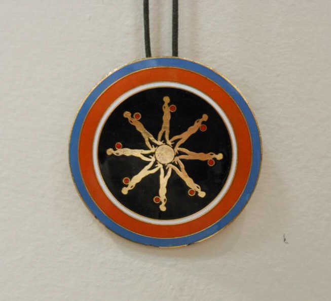 ERNEST TROVA, AMERICAN (1927-2009): Falling Man pendent with cord necklace. 2 1/2 inches (diameter)