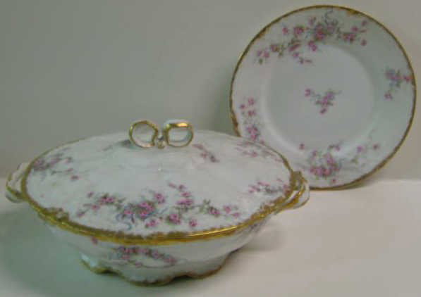 THEODORE HAVILAND, LIMOGES, FRANCE: Porcelain partial dinner service decorated in Schleiger style of floral sprays and wreaths with molded and gilt rims comprising 8 dinner plates, 10 soup bowls, 11 salad plates, 6 cups, 10 saucers, 7 s