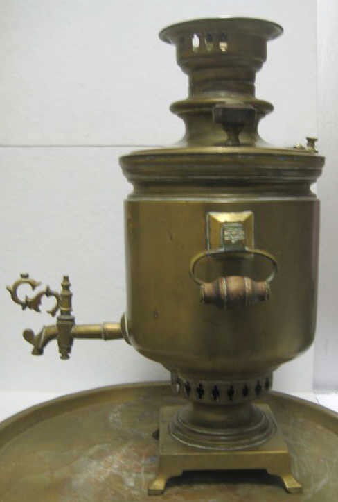 RUSSIAN BATASHEV'S BROTHERS SAMOVAR: Footed and two-handled barrel shaped with spigot, on square base, with lidded coal pipe, vent cover and crown together with footed drip bowl and round tray; marked, Ivan & Alexey Batashev's Factory, T