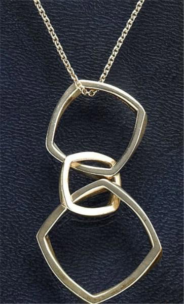 FASHION PENDANT TIFFANY & CO.: Sterling pendant with triple geometric open dangling links suspended on a cable link chain. Designed by Frank Gehry with the original pouch and box.