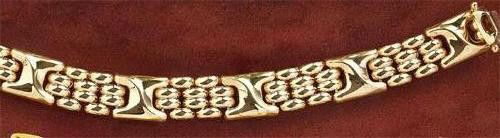 GOLD BASKET WEAVE AND "X" LINK BRACELET: 14k yellow gold basket weave links separated by "X" links. 7 inches. 14.6 grams.