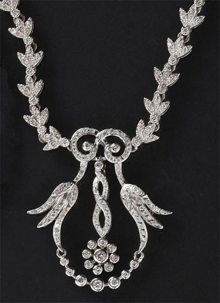 DIAMOND NECKLACE: 14k white gold necklace with Edwardian garland style set with two hundred fifty-nine round brilliant cut diamonds weighing approximately 4.50ct.t.w. 16 1/4 inches. 48 grams.