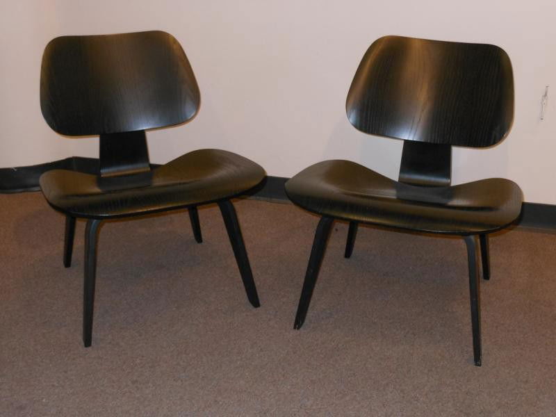 CHARLES EAMES FOR HERMAN MILLER: Pair of ebonized birch LCW chairs, oval Herman Miller label. 26 x 22 inches