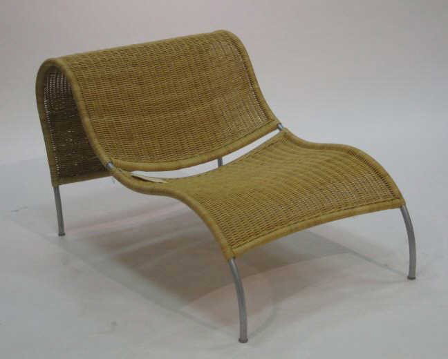 ARORG: STEPPE LOUNGE, natural rattan and metal frame, outdoor use. 26 1/2 x 29 1/2 inches Retail Price: $ 890.00