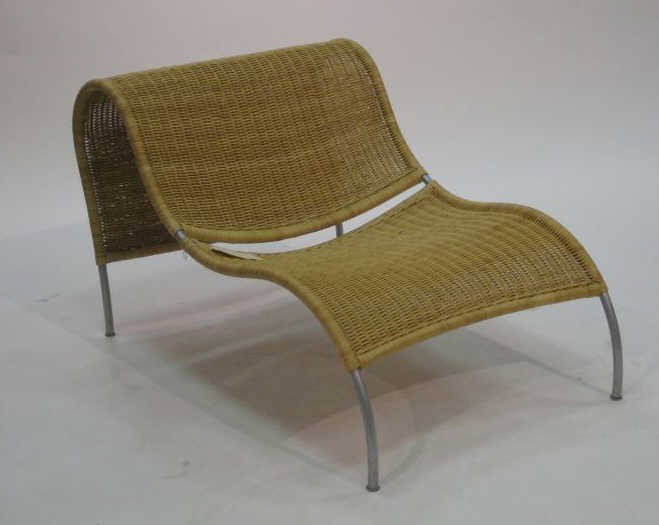 ARORG: STEPPE LOUNGE, natural rattan and metal frame, outdoor use. 26 1/2 x 29 1/2 inches Retail Price: $ 890.00