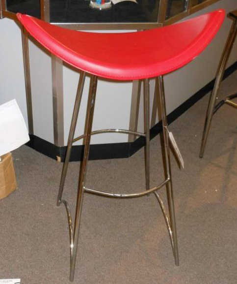 Pair of Contemporary barstools with chrome: bases and red upholstered seats.