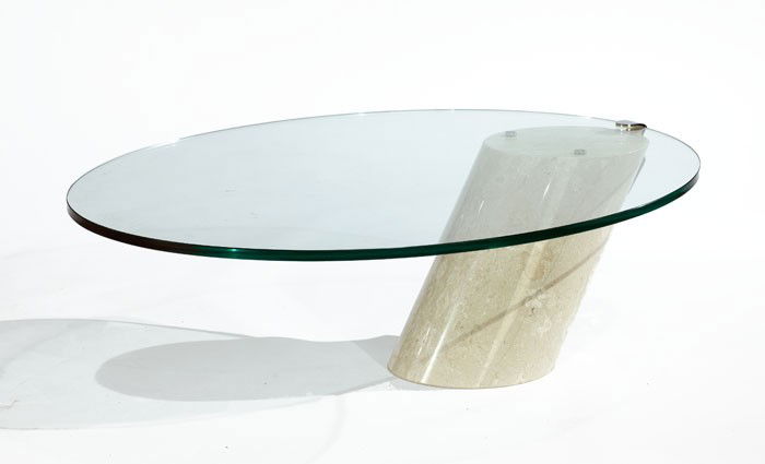 LUCIA MERCER FOR KNOLL: Coffee table, marble base holding an oval glass top. 17 1/2 x 39 x 50 inches