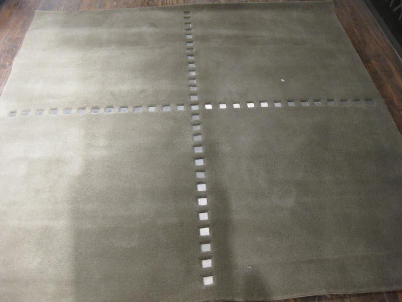 PETER MALY FOR LIGNE ROSET: Pythagore wool carpet with metal inlay pattern, dark celadon. 77 x 78 inches Retail price: $ 2,185.00