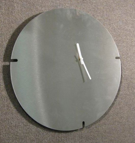 ARIK LEVY FOR LIGNE ROSET: Brushed metal notched wall clock, circular with white hands. 19 inches