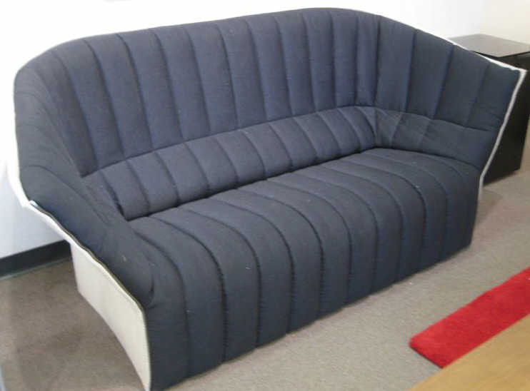 MOLE, LIGNE ROSET: Fabric soft side sofa, white tweed exterior with black channel interior. 37 1/2 x 77 inches