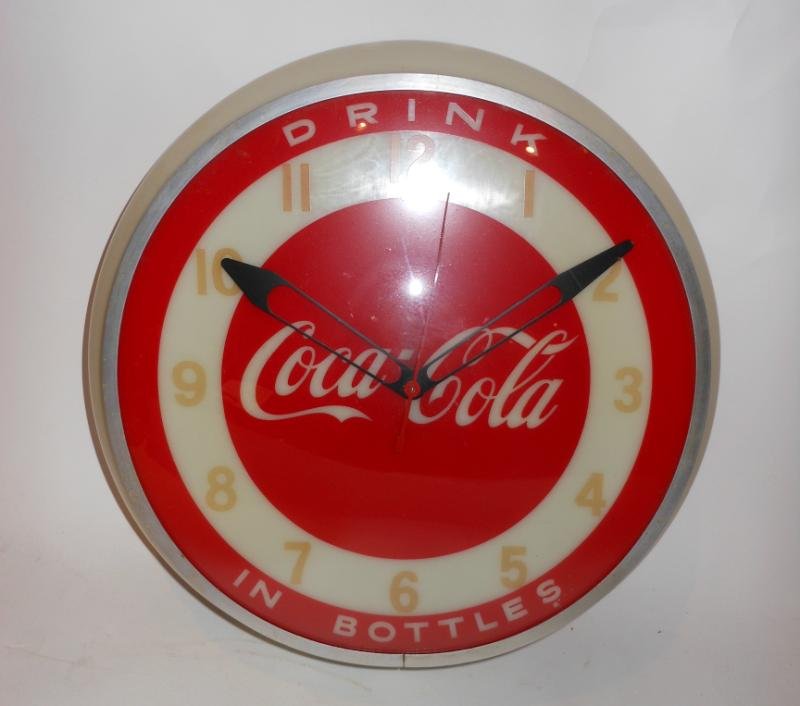 COCA-COLA WALL CLOCK: "Drink Coca-Cola - In Bottles", all red face with white ring running through the gold numbers, "Dualite Displays Inc., Advertising Signs & Clocks", 1950s.