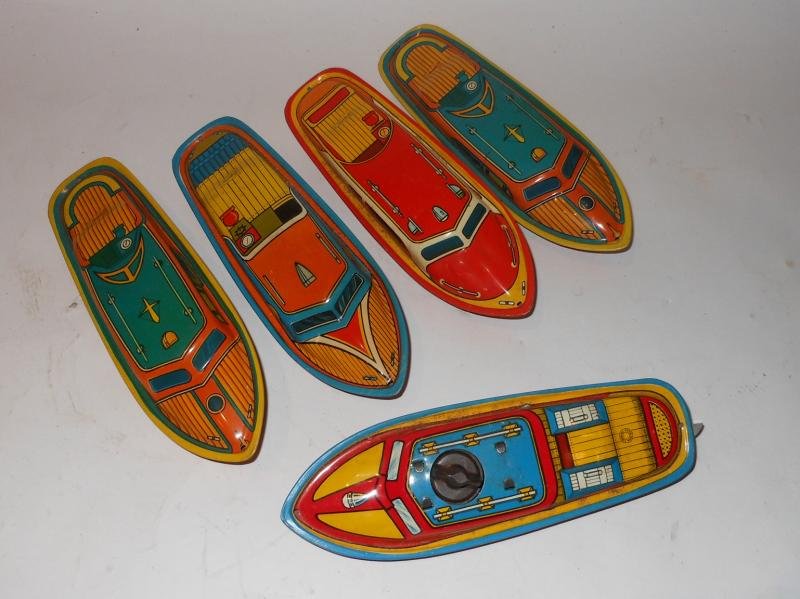 T. COHN INC. TIN LITHOGRAPHIC TOY BOATS: The wind up lead boat marked as above, with propeller and rudder, that tows for more tin litho boats, all marked "Superior", all boats length 7 1/2 in.