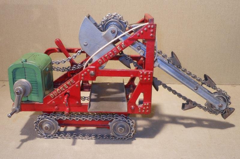 KENTON HARDWARE CAST IRON BUCKEYE DITCHER: Green engine and red frame, marked "Buckeye Ditcher" and "Kenton Toys Kenton Ohio", 13 in.