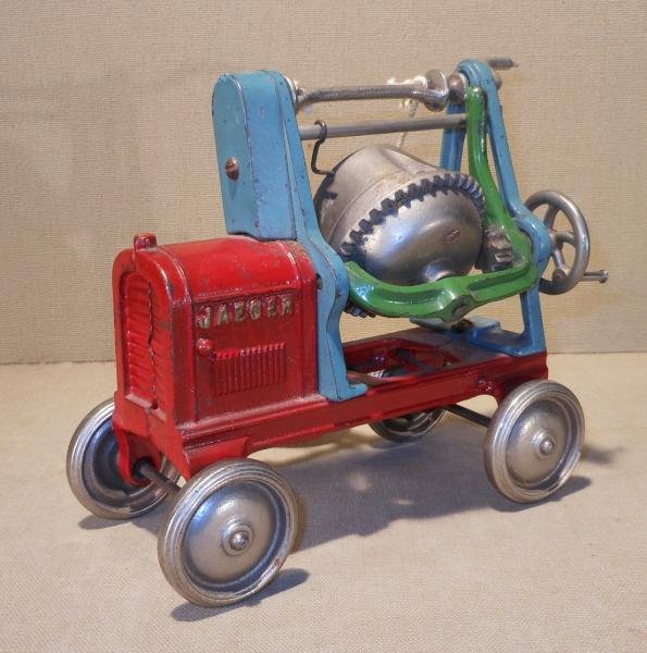 KENTON HARDWARE CAST IRON JAEGER CEMENT MIXER: Green and turquoise on red body, nickel highlights, marked "Jaeger" and "Kenton Toys Kenton Ohio", good condition, 7 in.