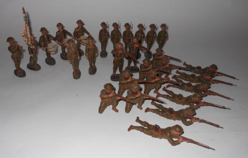 ELASTOLIN GERMAN COMPOSITION TOY SOLDERS: Twenty-eight pieces; flag bearer, three drummers, bugler, six marching, two standing firing, seven kneeling firing, six lying firing and two marching with swords; all marked "Elastolin - Germany".