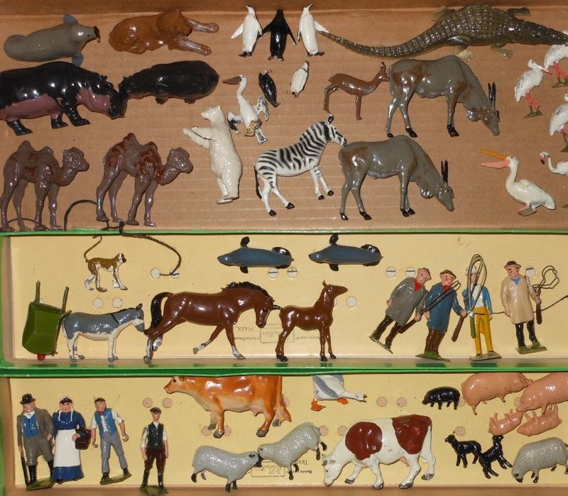 BRITAINS TOY FARM ANIMALS: A large selection including an adult crocodile, Eland bulls, lioness, Guinon monkey, polar bear, sea lions, walrus, baby camels, storks, flamingo, king penguins, pelicans, horses, cows, pigs, sheep, a