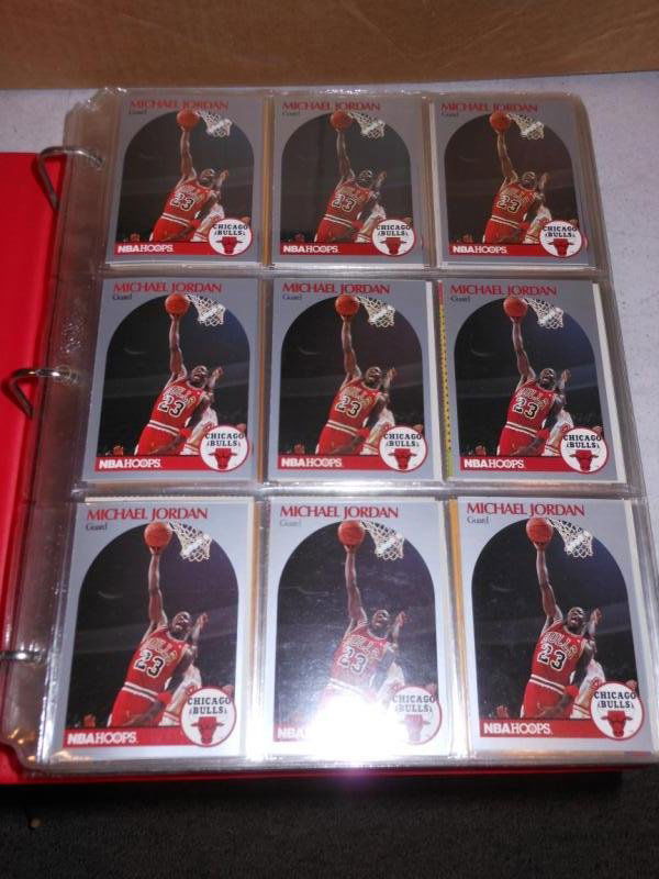LARGE COLLECTION OF MICHAEL JORDAN, MAGIC JOHNSON: LARRY BIRD AND DAVID ROBINSON BASKETBALL CARDS IN ALBUM.