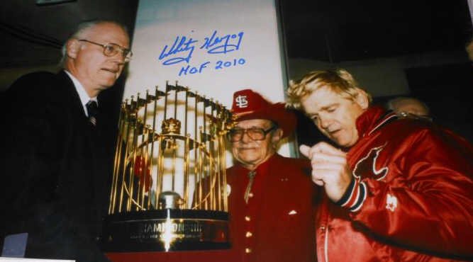 WHITEY HERZOG AUTOGRAPHED 16X20 PHOTOGRAPH: Herzog and Gussie Busch accepting the World Series trophy, with HOF 2010 inscription.