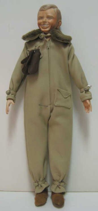 21" FAITH WICK CHARLES LINDBERGH PORTRAIT DOLL: Bisque shoulder-head, hands and feet, cloth body, marked, limited edition 345/1200, wearing aviator suit, boots and gloves.