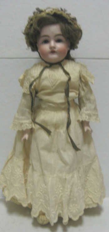 17" KESTNER CHILD DOLL, #154: Bisque shoulder-head, plaster dome, sleep eyes, open mouth, marked, on rivet jointed kid body.