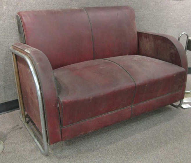 ATTRIBUTED TO WOLFGANG HOFFMAN: Two pieces; settee and club chair, red and black vinyl upholstery.