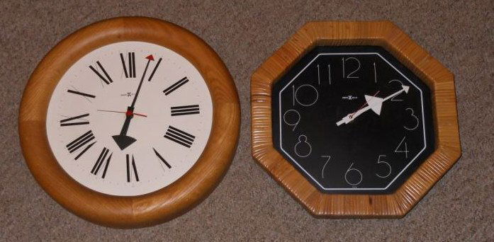 HOWARD MILLER: Two wall clocks, one with rattan frame.