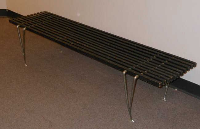 HUGH ACTON, AMERICAN: Slat bench, ebonized wood and chrome plated steel. 14 x 60 x 17 inches