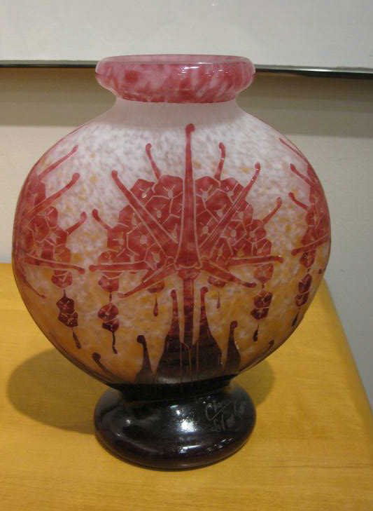 CHARDER, LE VERRE, FRANCAIS: Art Deco design overlay glass vase of flattened form with stylized floral motif, mottled from pink to burgundy on a white opaque ground, etched signature and "FRANCE" underfoot. 10 1/4 x 5 inches