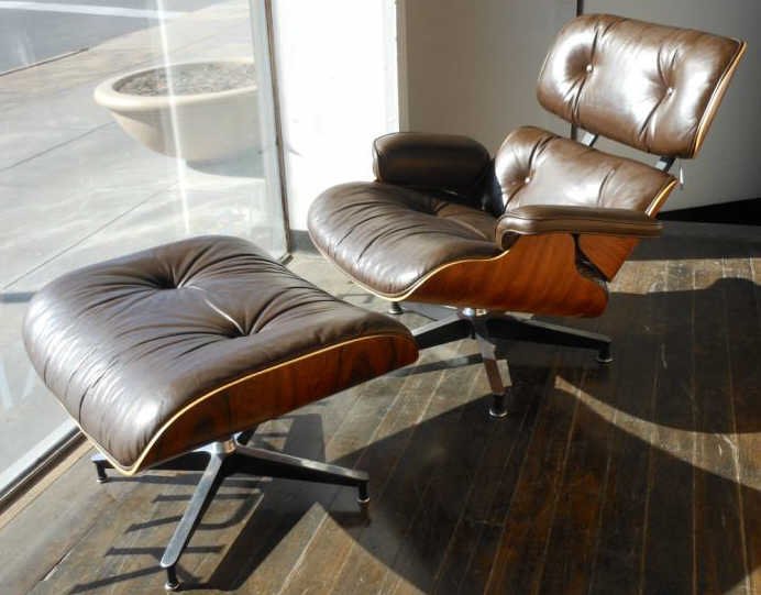 CHARLES EAMES FOR HERMAN MILLER: LOUNGE CHAIR & OTTOMAN, rosewood with brown leather upholstery, labeled.