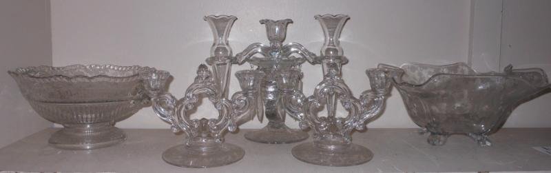 CAMBRIDGE ETCHED GLASS 'ROSE POINT' TABLE ARTICLES: A large footed bowl with ram mask handles, (h. 5 1/2'; d. 9 1/2"), a toed bowl of shaped square form (h' 5" x 10"), three-light candelabrum/centerpiece with removable arms holding conical vases, and a