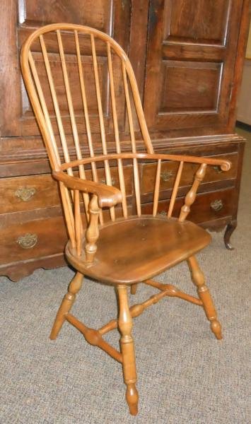 AMERICAN PENNYSLVANIA SACK BACK WINDSOR ARMCHAIR: Lancaster, hoop back with spindle supports, over the knuckle arms and saddle seat, with blunt arrow turnings. Height 44, width 25 in.Ref: Charles Santore, 1981, The Windsor Style in America, pp 102.