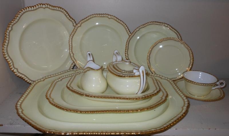 SPODE/COPELAND PORCELAIN DINNER SERVICE: Goldsmith pattern (Y487), gilt gadroon rimmed, pale yellow grounded comprising 14 dinner plates, 8 luncheon plates, 12 salad plates, 12 bread/butter plates, 12 cups and 12 saucers with vegetable bowl,