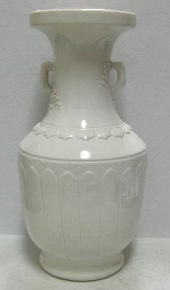 CHINESE BLANC DE CHINE VASE: Baluster body and flared long neck, applied two handles with molded floral motifs, the body with two rows of overlapping petals in relief (vertical crack), Dingyao style, unmarked. Height 12 1/16 inch