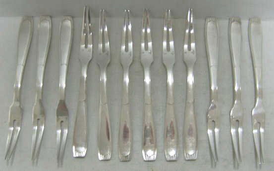 CHRISTOFLE PLATED SILVER SEAFOOD FORKS: Set of 12, two-tong, Art Deco pattern, marked, 20th century. Length 6 in.