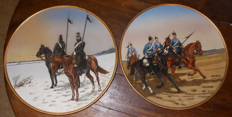 TWO V&B METTLACH MILITARY PLAQUES: Etched and polychrome decorated pottery chargers by Stocke, one depicting Cavalry soldiers on horseback; two Ulans on one and four Dragoners on the other, #2078 and #2079, incised marks and numbers, 1