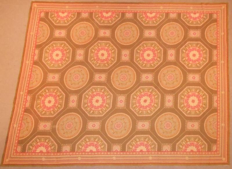 NEEDLEPOINT ROOM RUG: Foliate medallions cover the medium green/brown field. 9 ft. x 11 ft. 4 in.