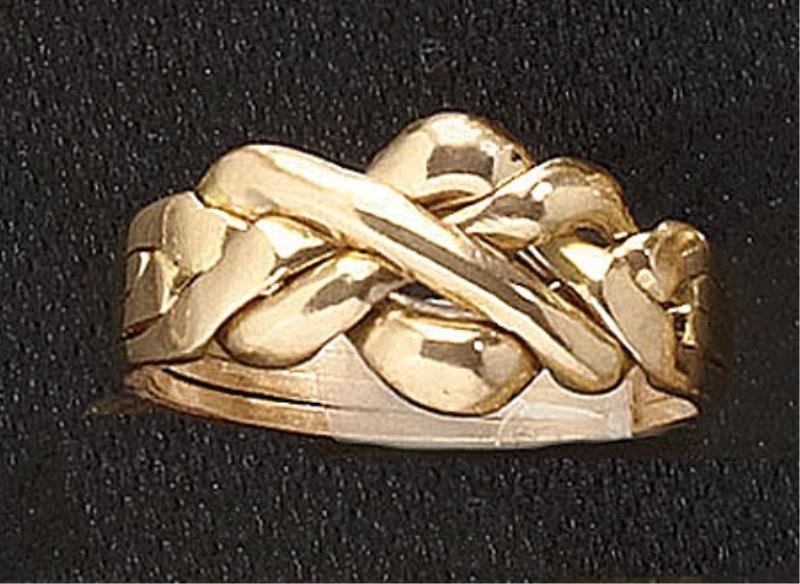 PUZZLE RING: 14k yellow gold four ring set that fits together to make one ring. Size 7 1/2. 4.1 grams.