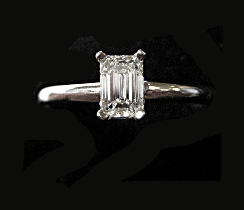 EMERALD CUT DIAMOND RING: Platinum ring set with one emerald cut diamond weighing .47ct. accompanied by a G.I.A. Report stating Color F, Clarity VS1. Size 7 1/2. 3.6 grams.