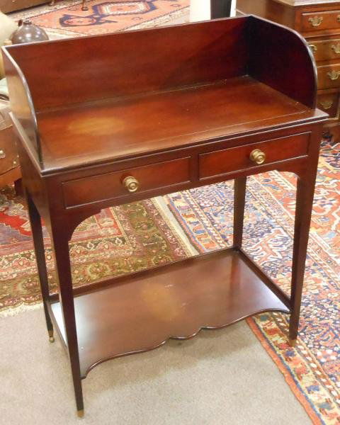 HEPPLEWHITE STYLE MAHOGANY WASHSTAND: By Kittinger, with 3/4 tall galleried rectangular top, over two frieze drawers, on tapering square legs with full stretcher / shelf below. Height 39, width 29, depth 15 in.